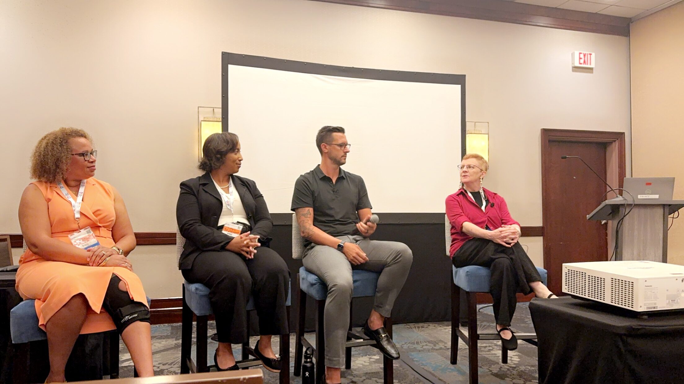Ruth Pearce on a conference panel, speaking